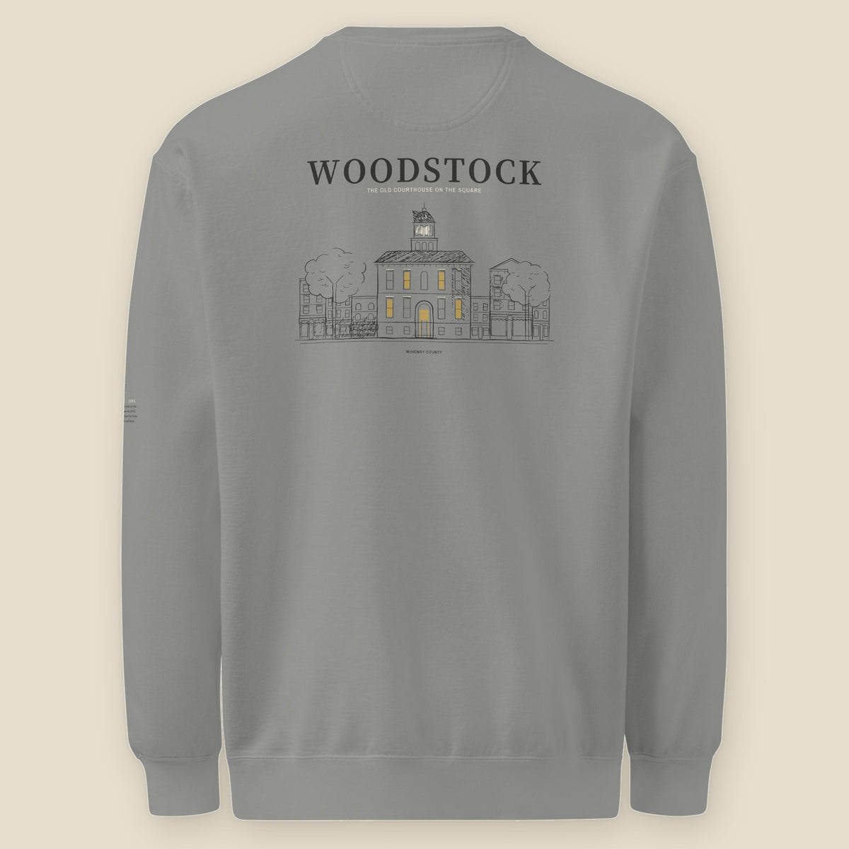 Woodstock Crewneck, back, Grey: WOODSTOCK over the Old Courthouse on the Square, its windows lit in gold