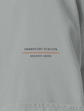 Frankfort Tee, left sleeve close-up, Granite: FRANKFORT STATION over a rust rule and BREIDERT GREEN