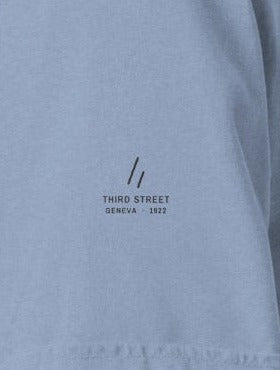 Geneva Tee, left sleeve close-up, Washed Denim: the mark over THIRD STREET and GENEVA · 1922
