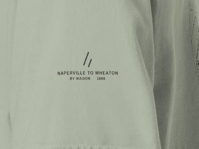Wheaton Tee, left sleeve close-up, Bay: the mark over NAPERVILLE TO WHEATON, BY WAGON · 1868