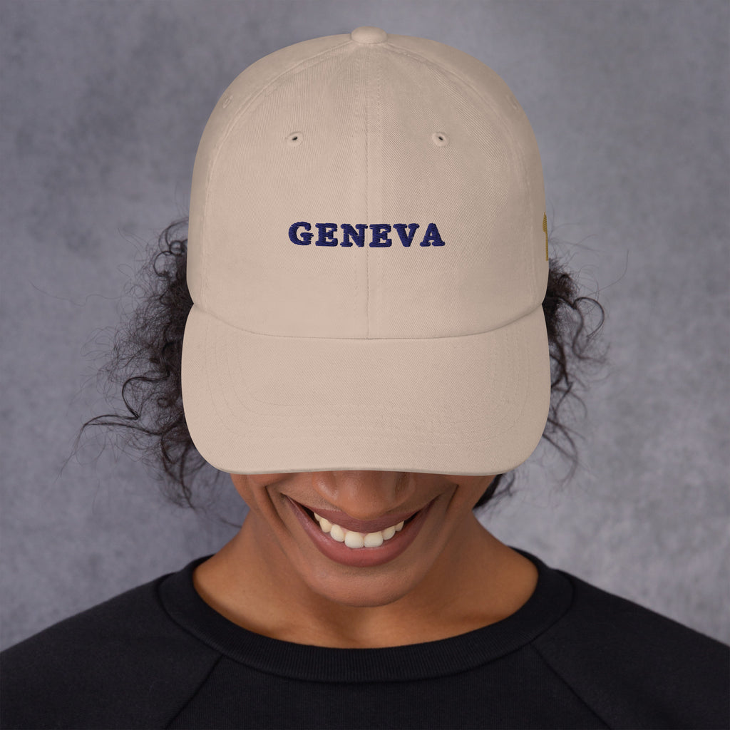 Geneva Hat, front, worn, Stone: GENEVA stitched in navy across the front panel