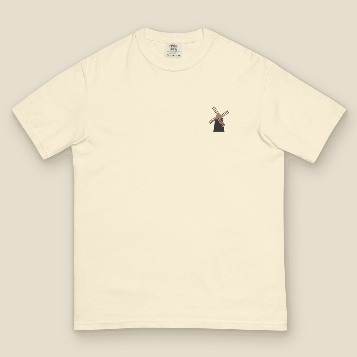 Fabyan Tee, front, Lemont Stone (Ivory): a small windmill printed at the left chest.