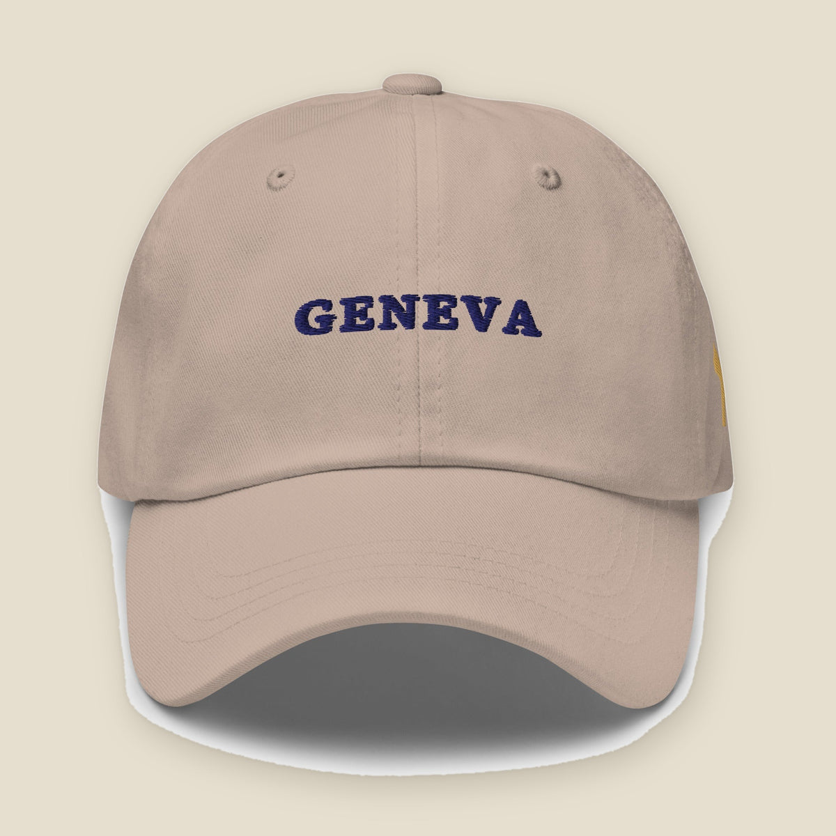 Geneva Hat, front, Stone: GENEVA stitched in navy across the front panel