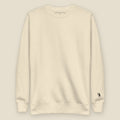 Green River Crewneck, front, Bone: plain front, the six-county mark stitched small at the left wrist.