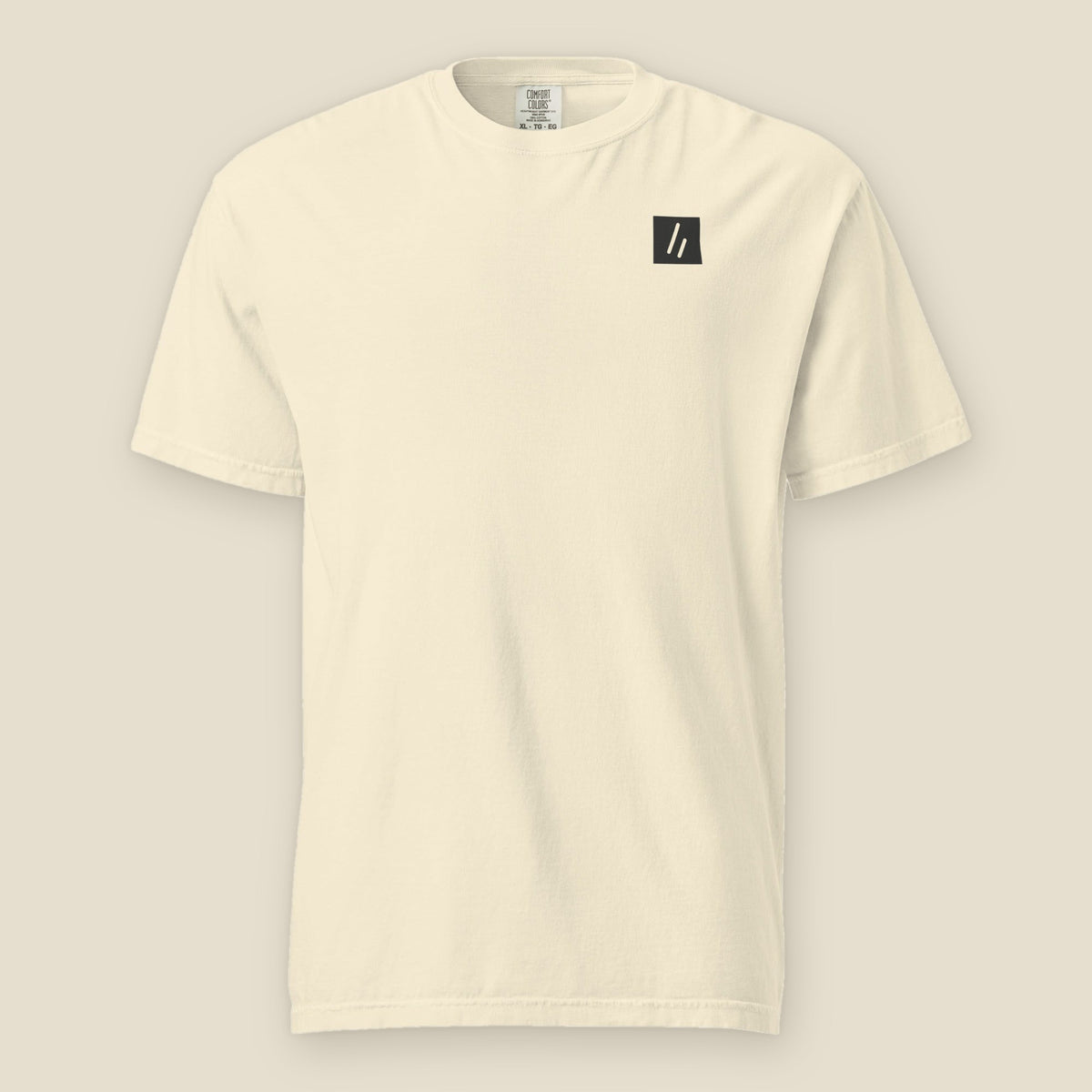 Illinois Beach Tee, front, Lemont Stone (Ivory): the double slanted line mark in a small dark chest patch