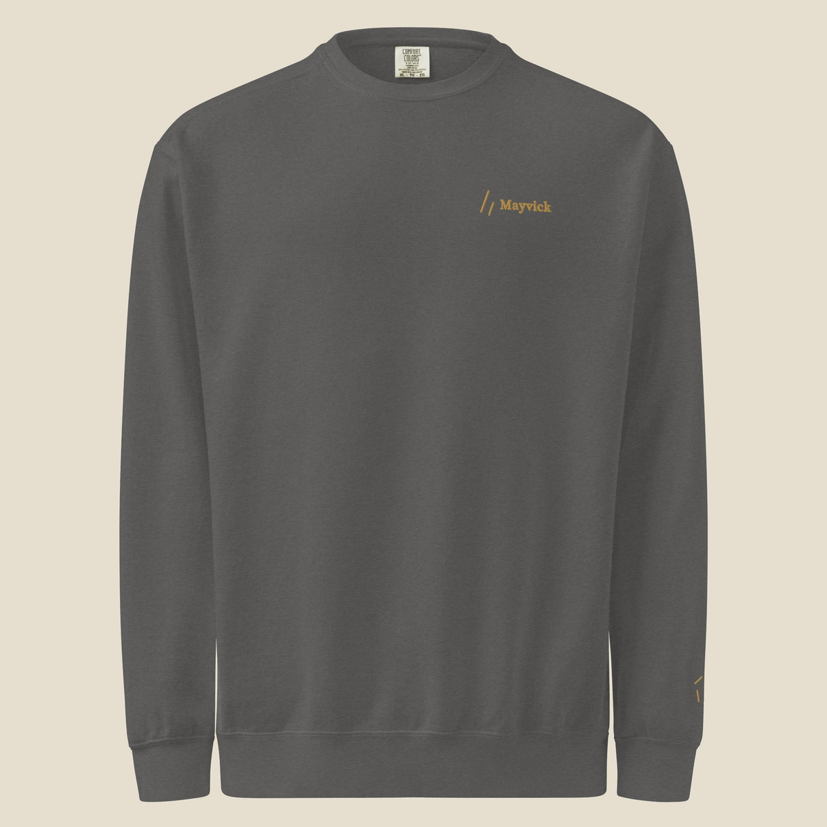 Crewneck, Pepper, front: the double slanted line mark and Mayvick stitched in Old Gold at the left chest.