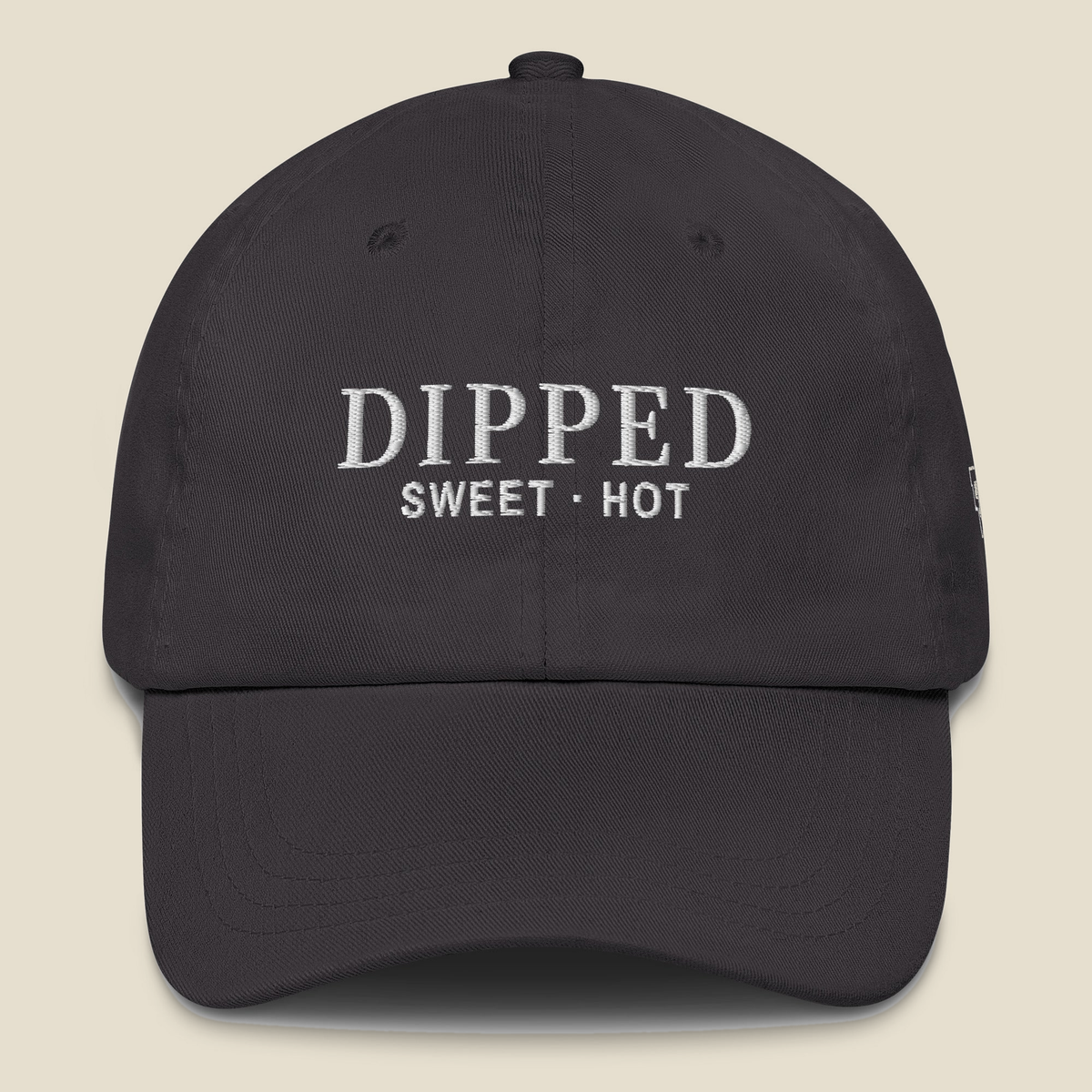 Dipped Dad Hat (Dark Grey), front, Dark Grey: DIPPED over SWEET · HOT stitched in white.