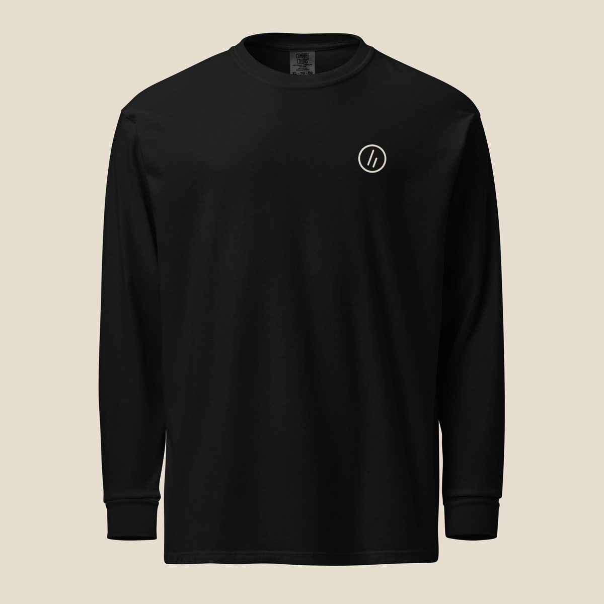 Midewin Long Sleeve, front, Black: the double slanted line mark inside a small cream circle