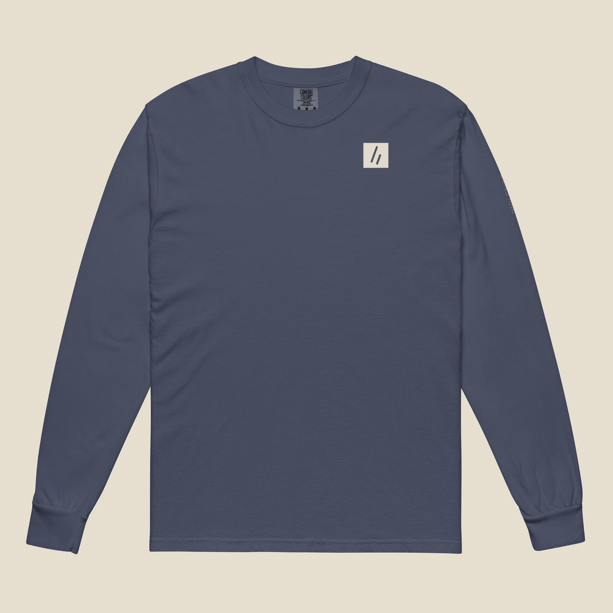 Volo Bog Long Sleeve, front, Navy: the double slanted line mark knocked out of a small cream chest patch