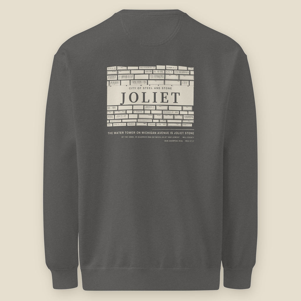 Joliet Crewneck, back, Pepper: cut limestone wall with JOLIET carved into the lintel