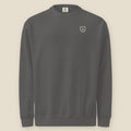 Joliet Crewneck, front: the double slanted line mark inside a small cream shield