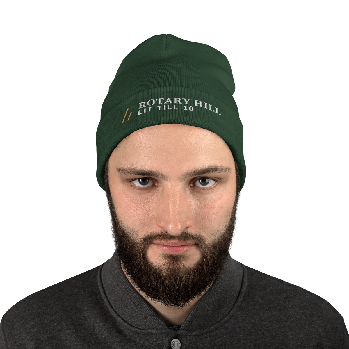 Rotary Hill Beanie, worn, front, Dark Green: the Old Gold mark, ROTARY HILL over LIT TILL 10 in white