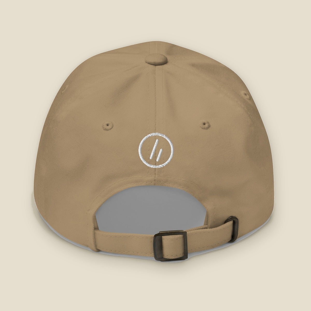 Mayvick Dad Cap, back, Khaki: the white stitched roundel symbol with the double slanted line mark.
