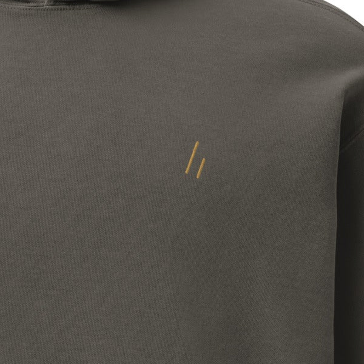 Hoodie, chest close-up, Pepper: the double slanted line mark stitched small in gold thread.