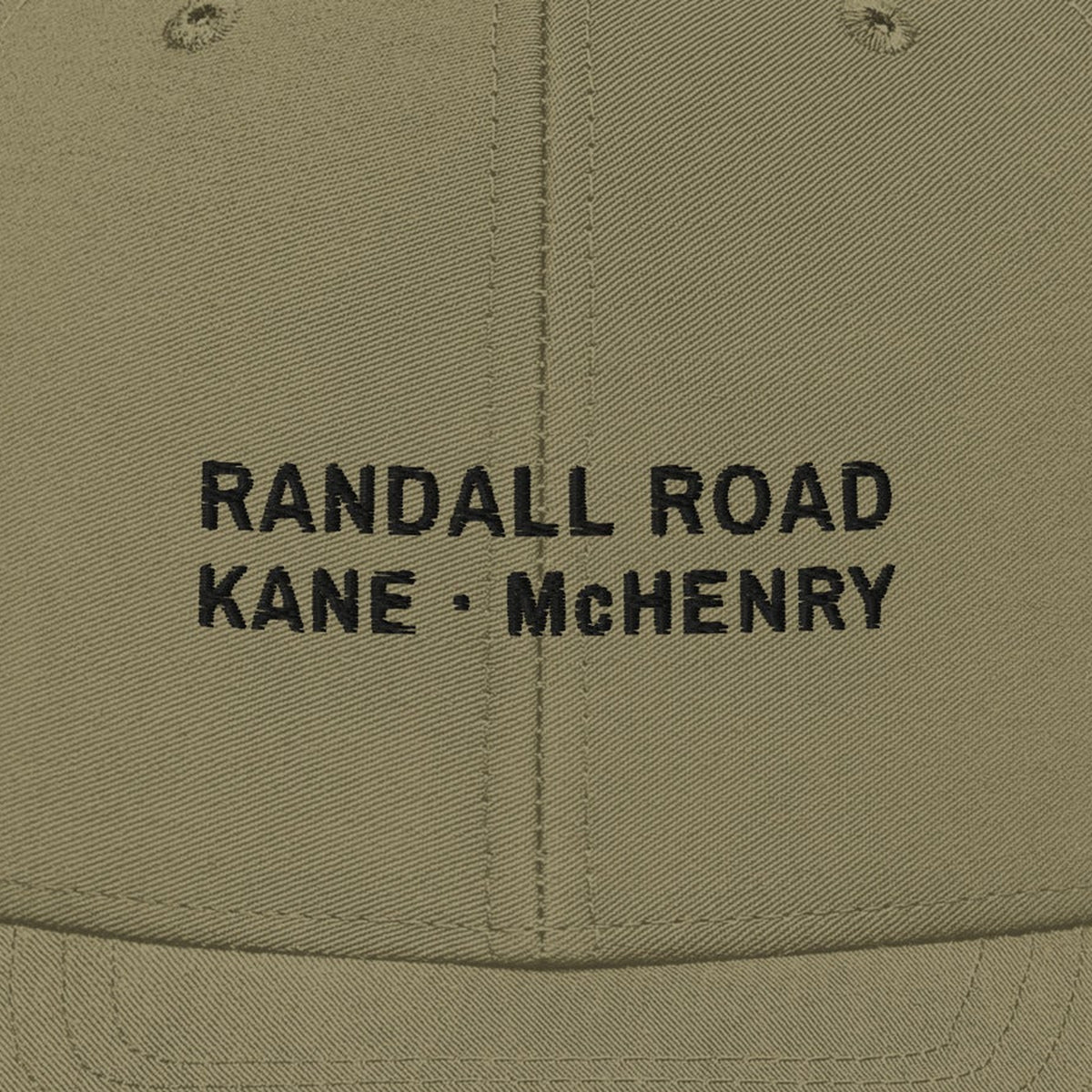 Randall Road Trucker Cap, front close-up, Light Olive: RANDALL ROAD over KANE · McHENRY stitched in black.