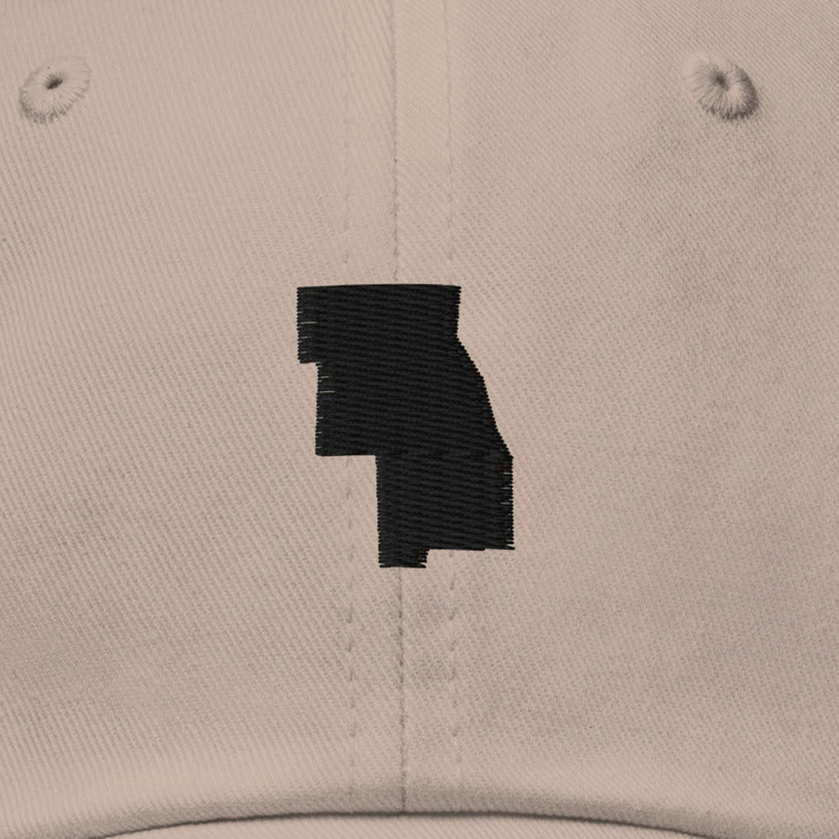 Six County Dad Hat, front close-up, Stone: the six counties stitched in black as one shape.