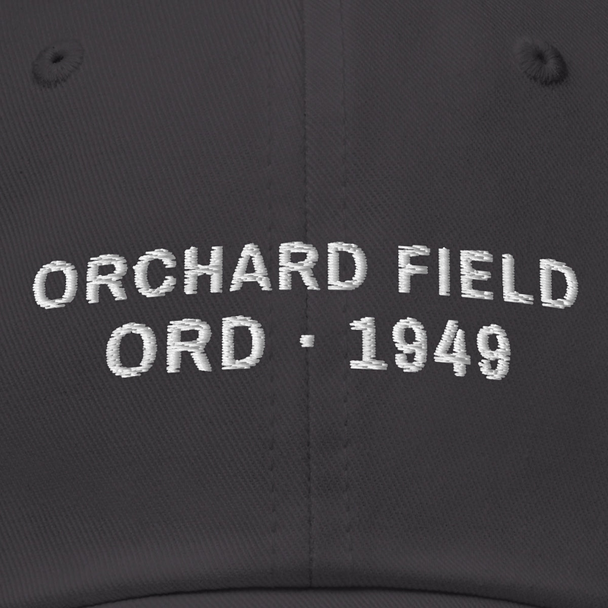 Orchard Field Dad Hat, front close-up, Dark Grey: ORCHARD FIELD over ORD · 1949 stitched in white