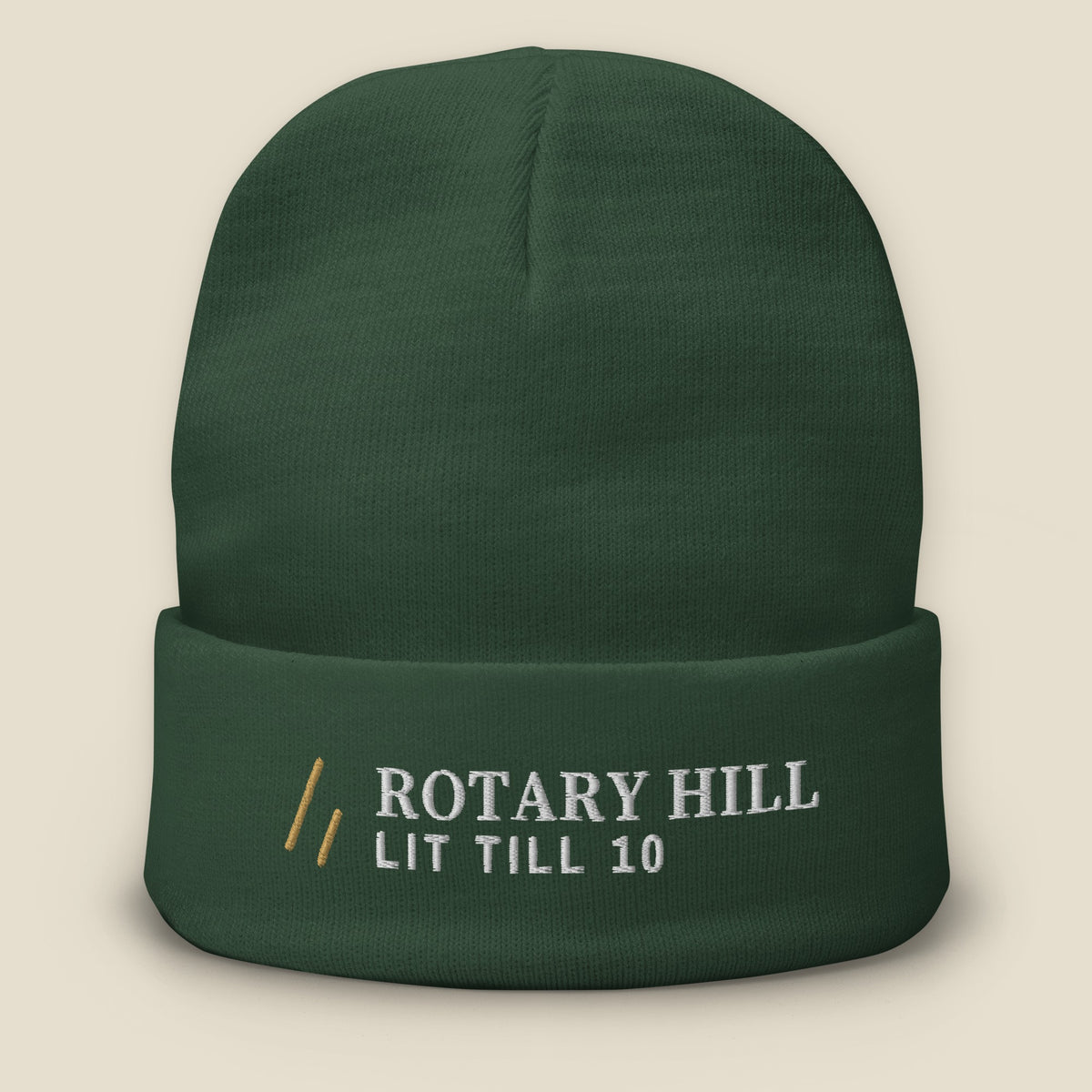 Rotary Hill Beanie, front, Dark Green: the full Old Gold mark, ROTARY HILL over LIT TILL 10 in white