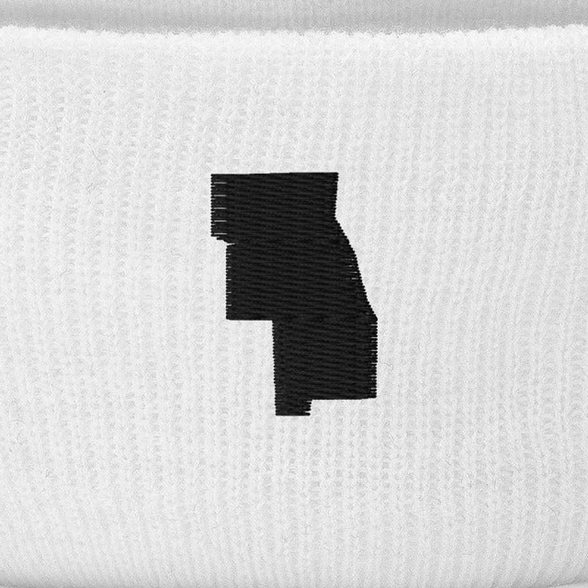 Six County Beanie, cuff close-up, White: the six-county outline stitched in black