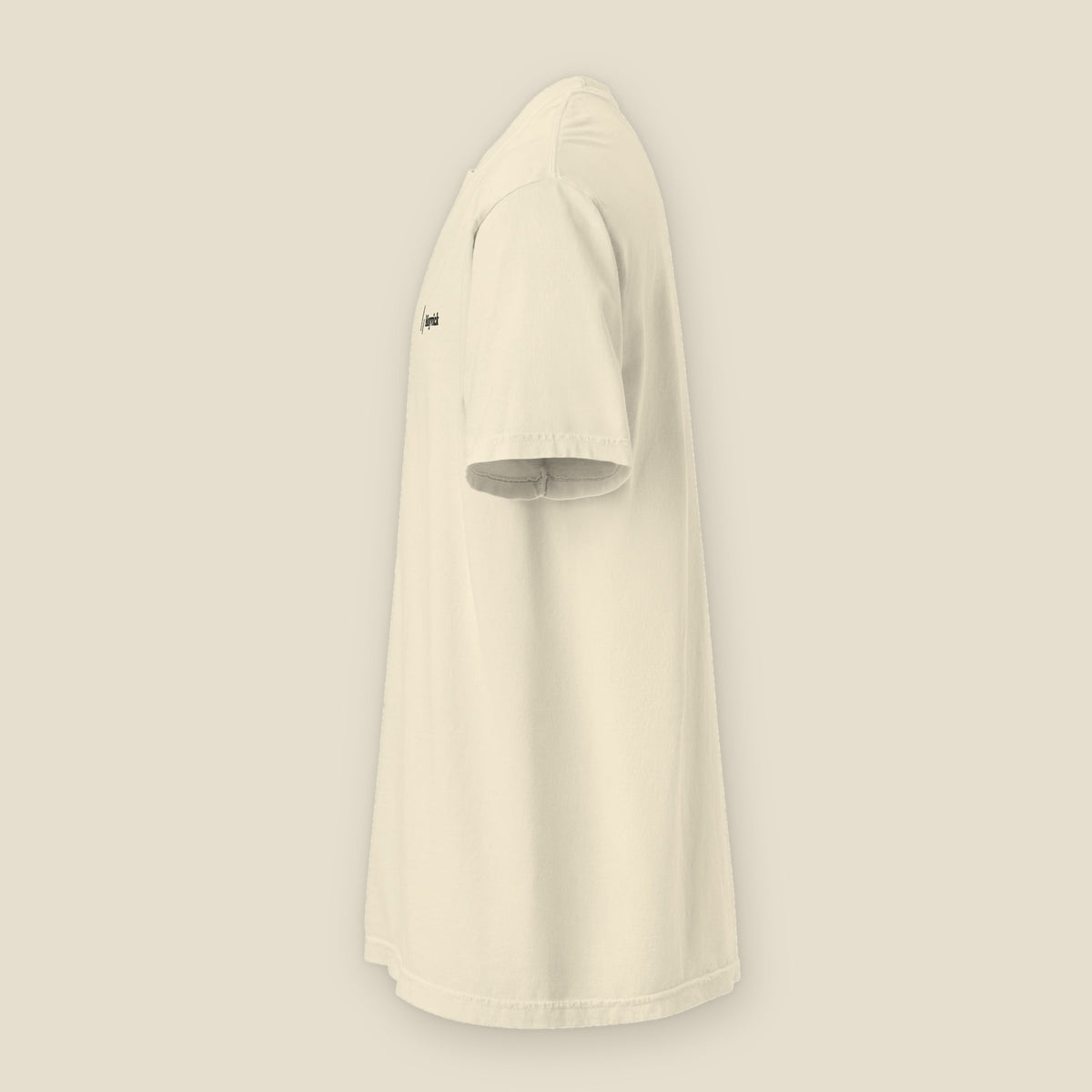 Stitched Tee, Ivory, left side view: the edge of the stitched chest mark.
