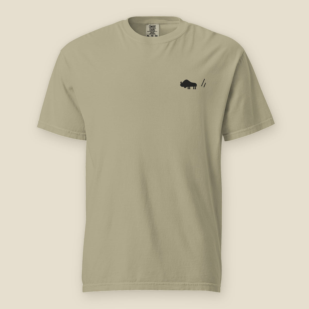 The Herd Tee, front, Prairie Path (Khaki): a stitched bison and the double slanted line mark, left chest.