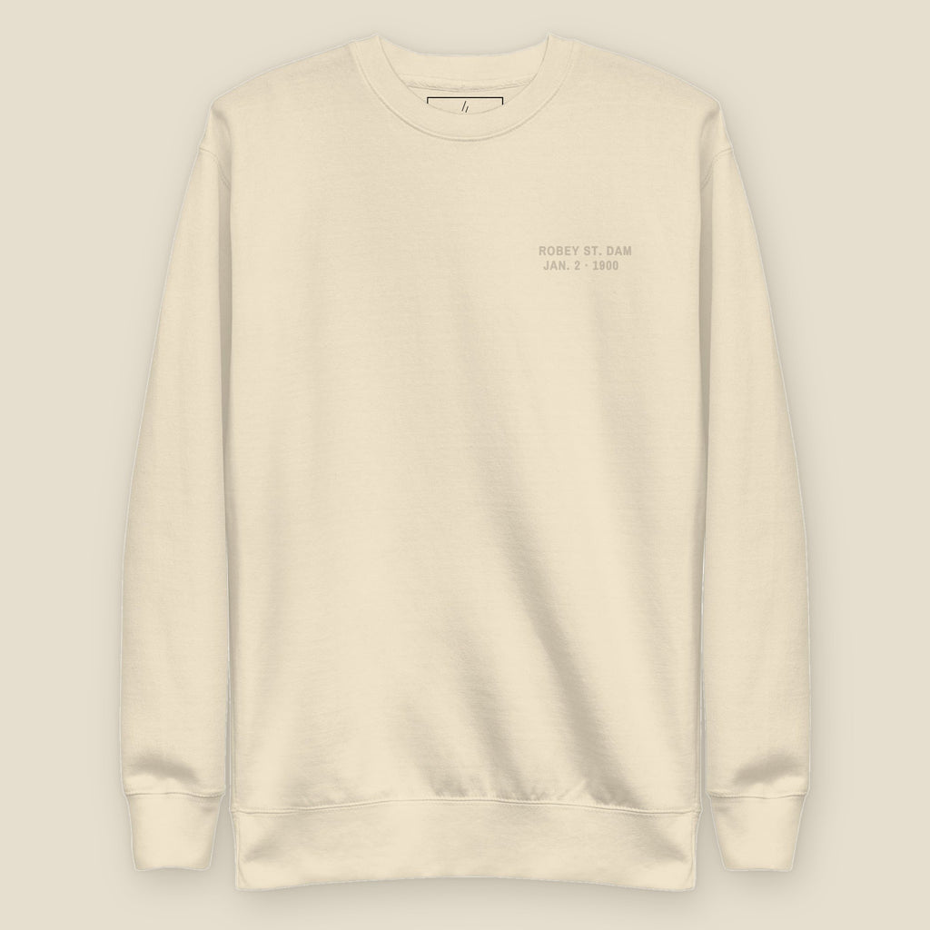 The Reversal Crewneck, front, Lemont Stone (Bone): ROBEY ST. DAM / JAN. 2 · 1900 in tone, left chest.