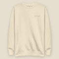 The Reversal Crewneck, front, Lemont Stone (Bone): ROBEY ST. DAM / JAN. 2 · 1900 in tone, left chest.