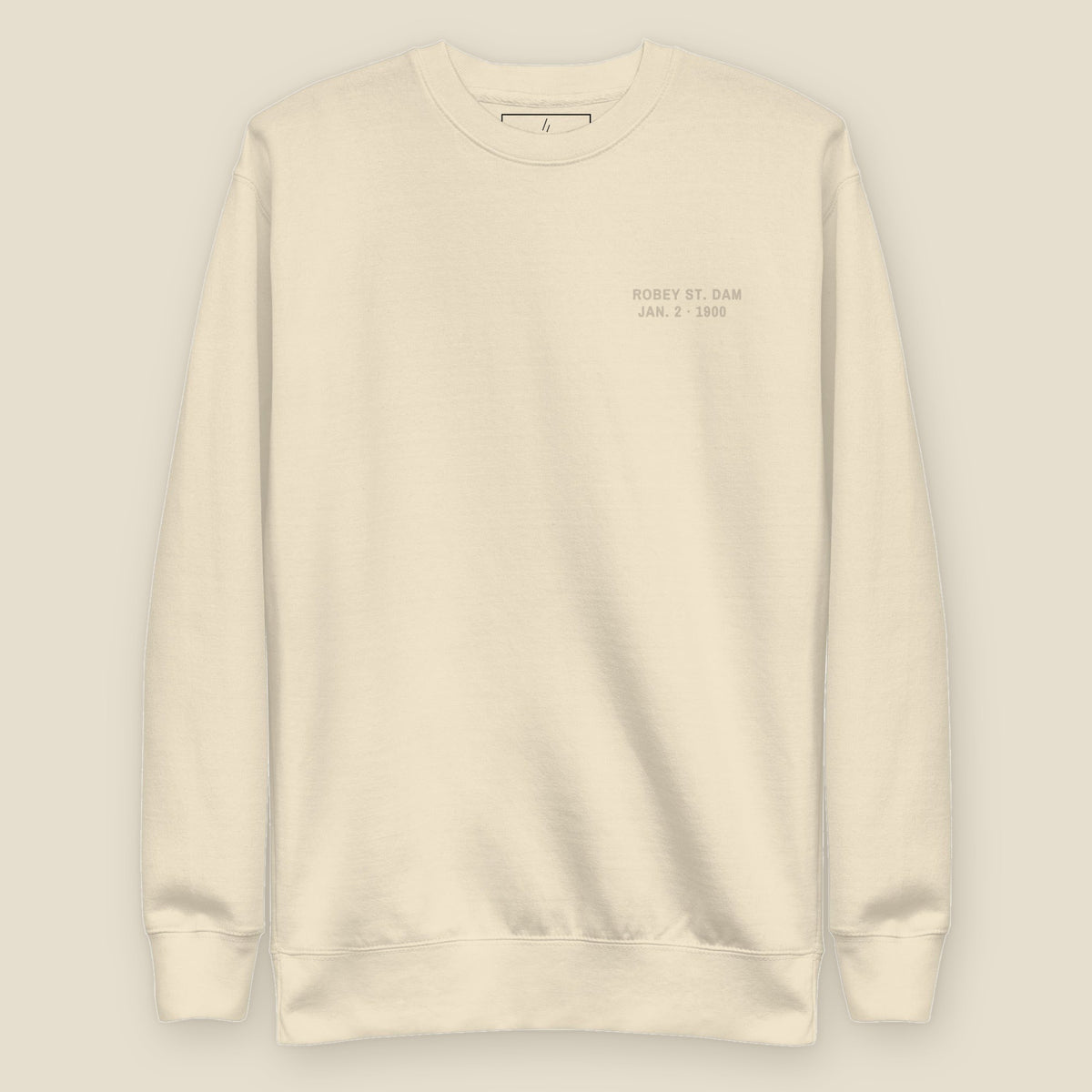 The Reversal Crewneck, front, Lemont Stone (Bone): ROBEY ST. DAM / JAN. 2 · 1900 in tone, left chest.