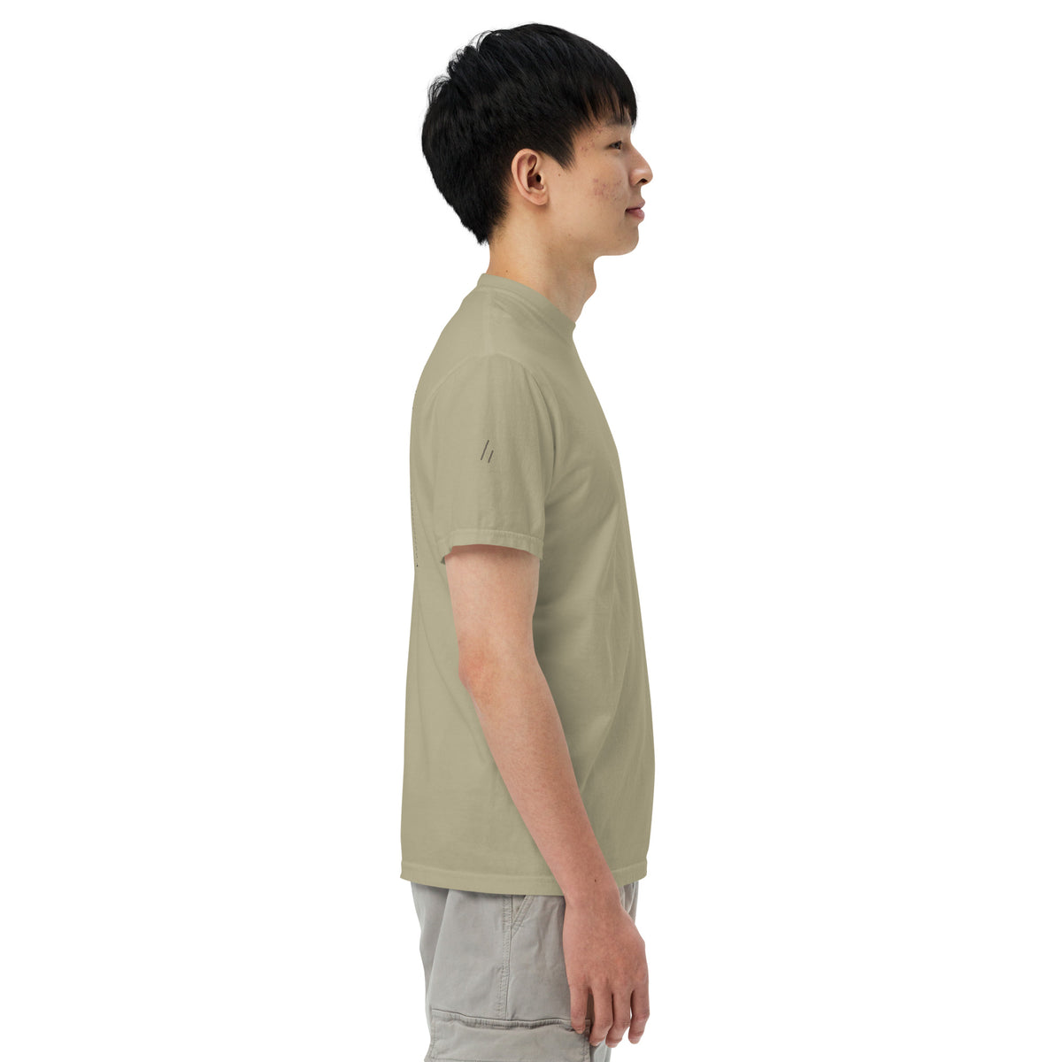 125 Steps Tee, right side on a model, Prairie Path (Khaki): the right sleeve, the mark tone on tone.