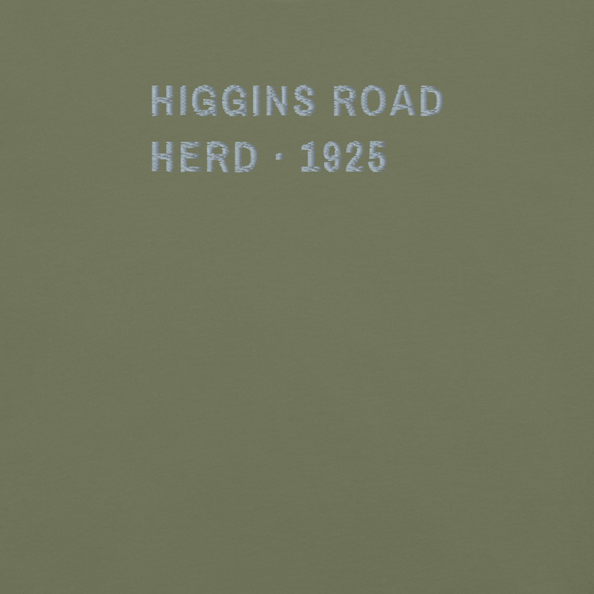 The Elk Tee, chest close-up, Moss: HIGGINS ROAD and HERD · 1925 stitched in grey thread.