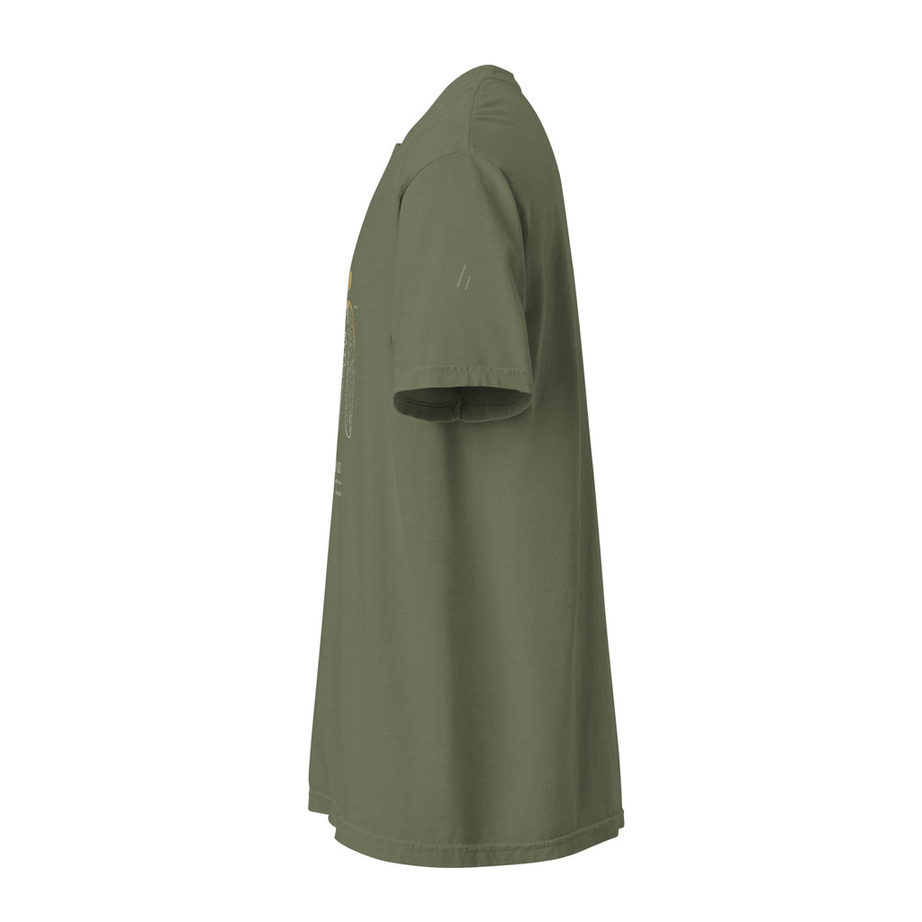 Left side: moss green tee with a small tone-on-tone Mayvick two-bar mark on the sleeve
