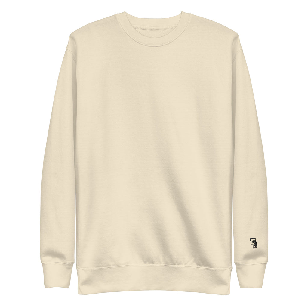 Cream fleece crewneck, front: plain, small mark at the wrist